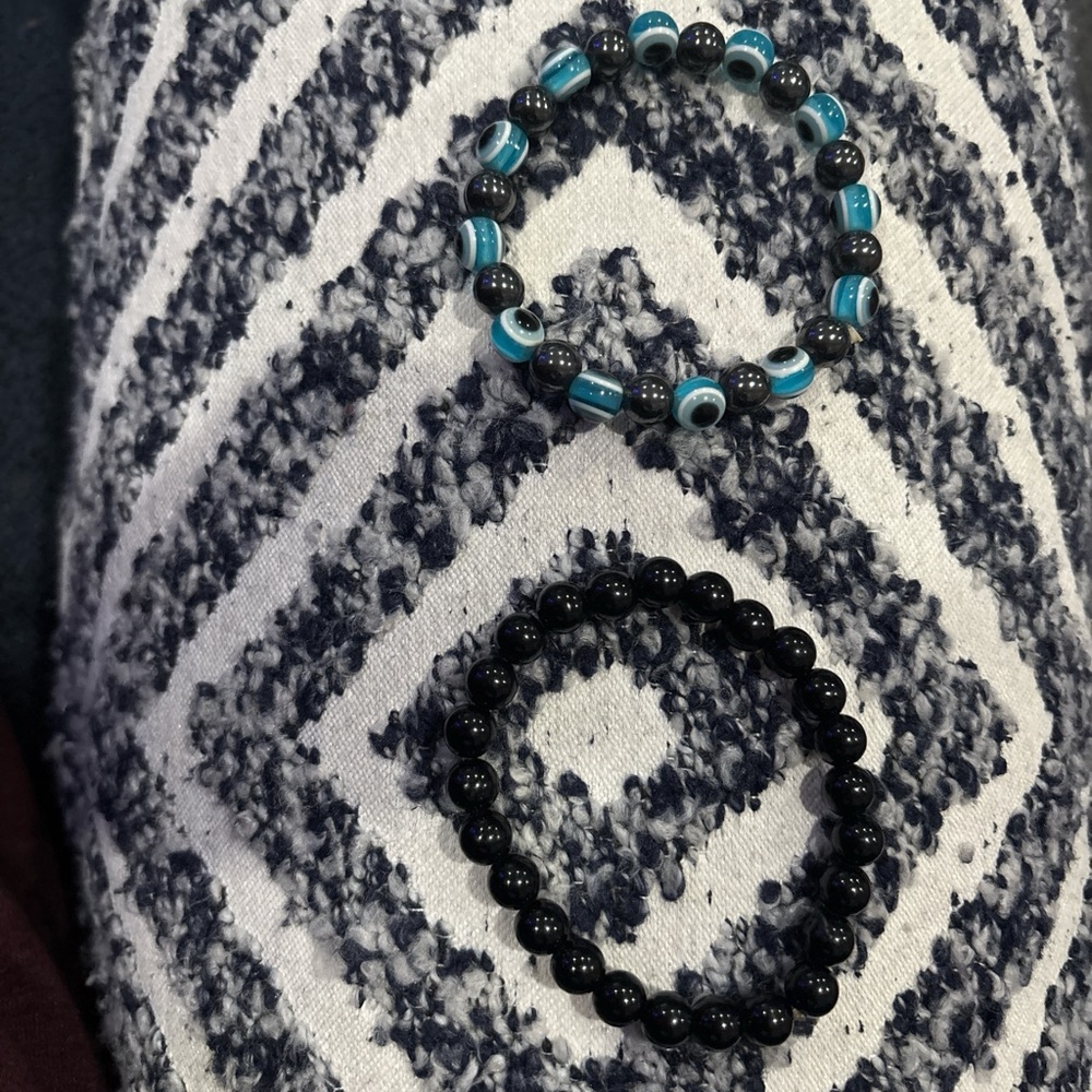 evil eye and black stretch bracelets